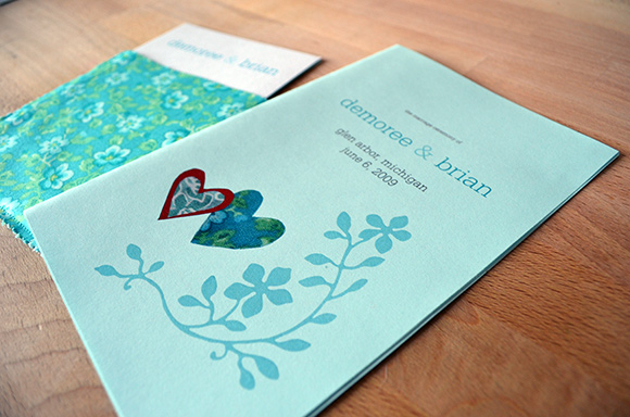Wedding program with flower and fabric motif and invitation